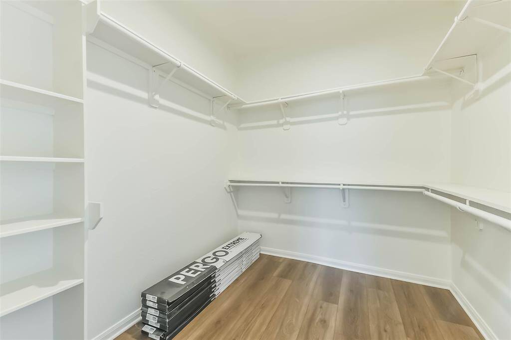 Expansive walk-in closet in the primary suite.