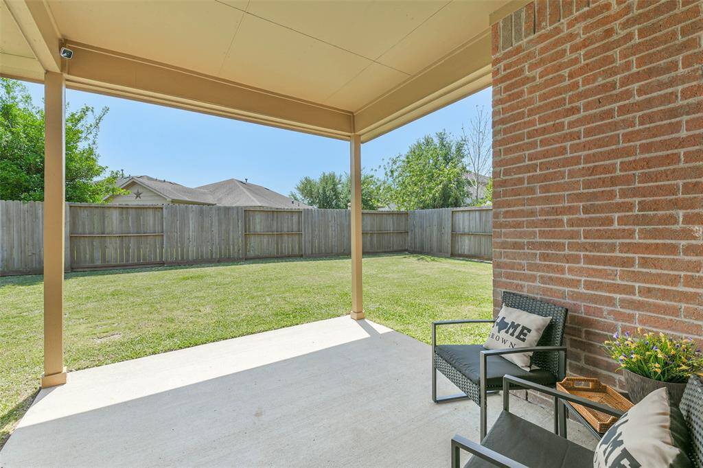Relax on the patio while your pets enjoy the spacious backyard!
