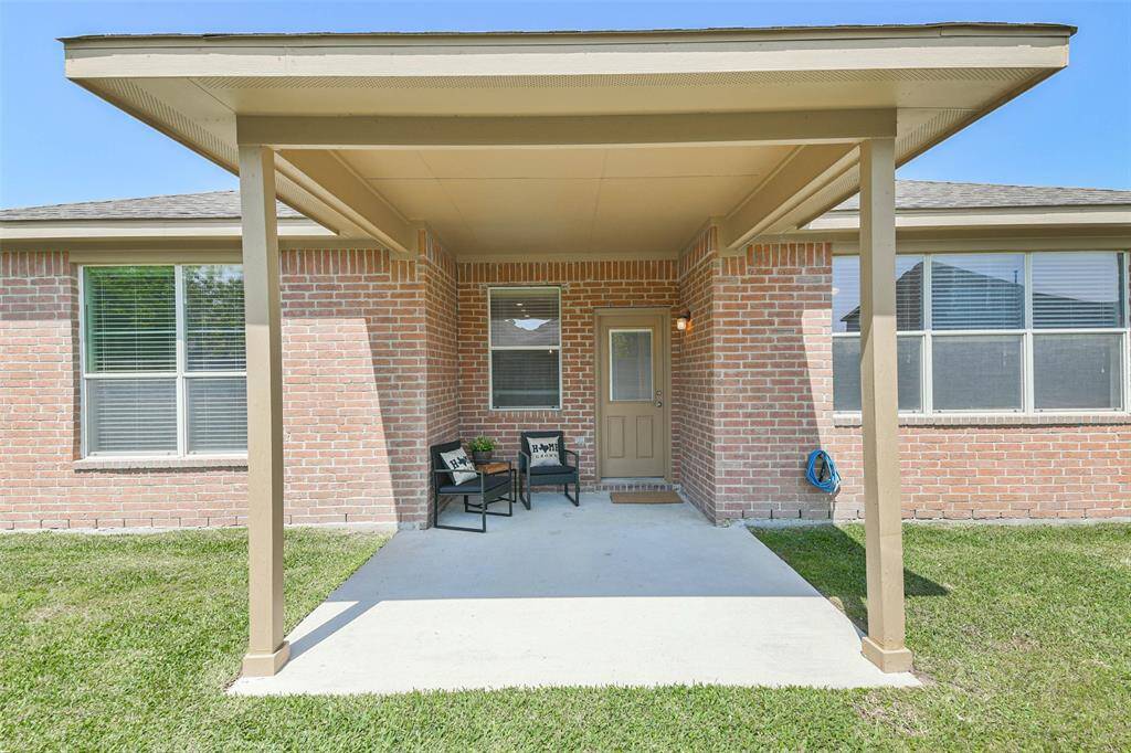 Large back porch, perfect for outdoor dining and relaxation.