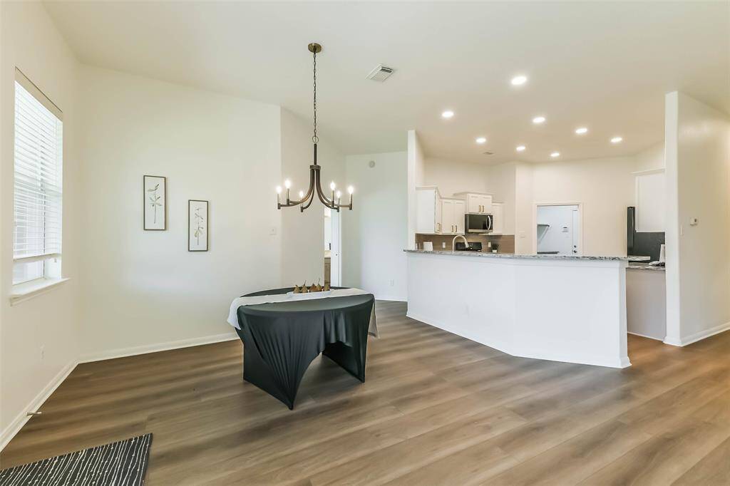 The dining area can easily fit a much larger table.