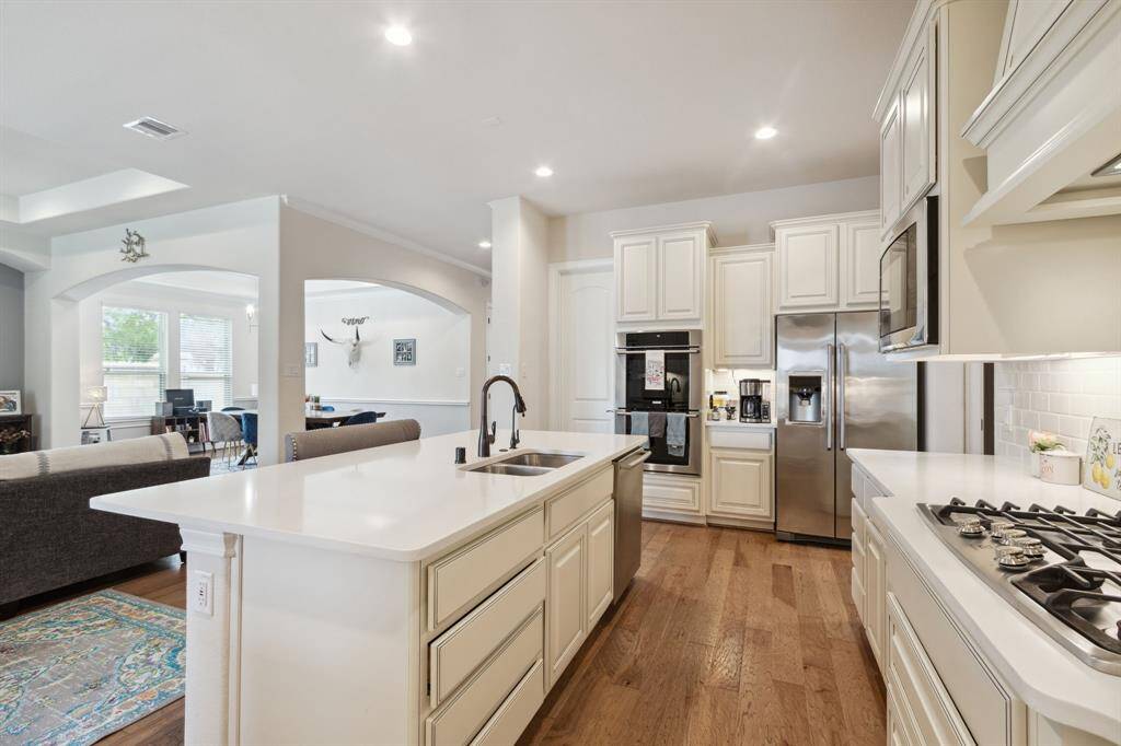Stainless appliances with gas cooktop, double oven, microwave (not over the cooktop for ease of access) and dishwasher.  Lots of storage with the 42" cabinets.