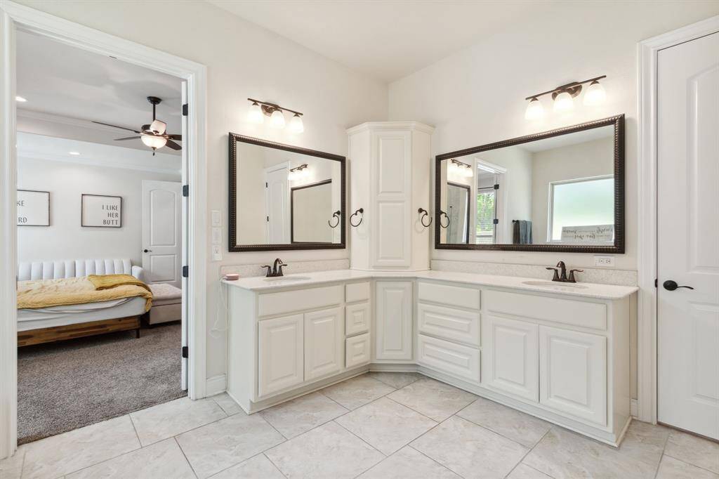 Dual vanities with framed mirrors.