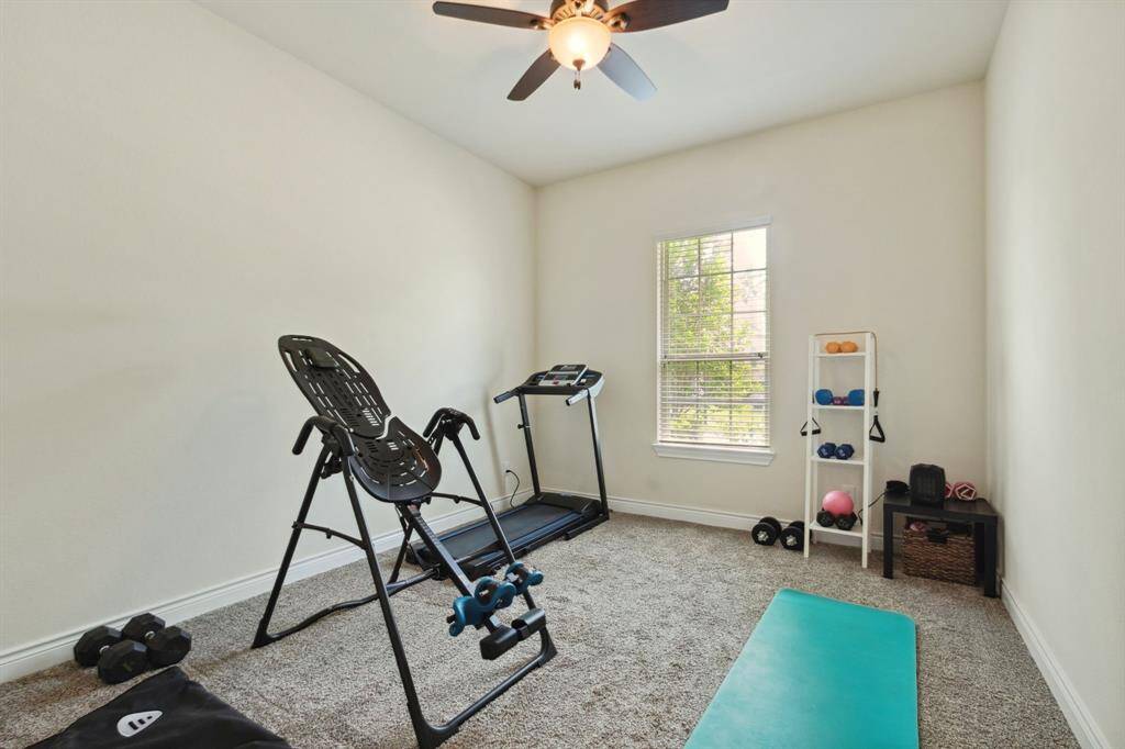 Gues bedroom at front of home currently used as a workout room.