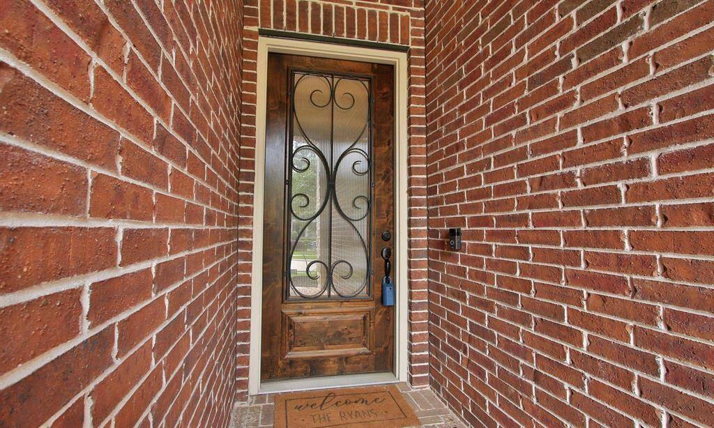 Beautiful 8 foot mahogany door with wrought iron inlays.