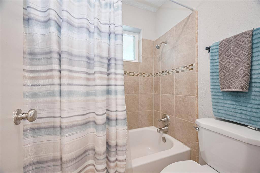 2nd full bath has shower tub combo.
