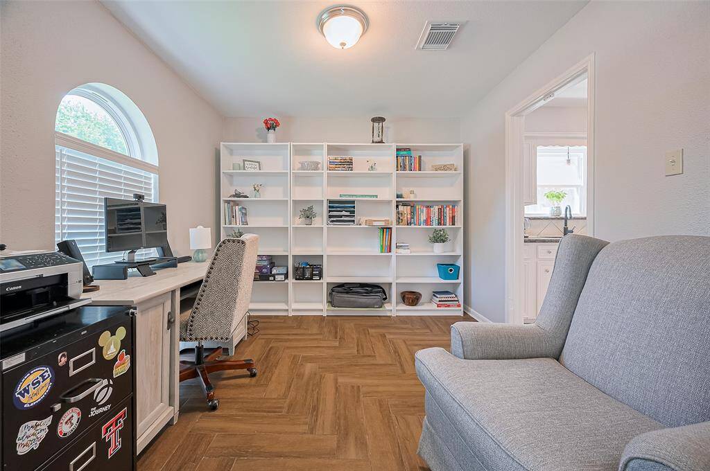 Formal dining room is used as a home office. Built ins.