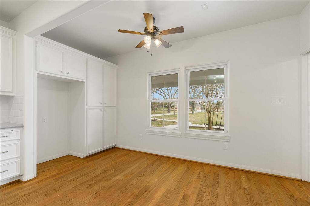 Breakfast nook in the kitchen with window overlooking Texas sized covered patio and front yard.
