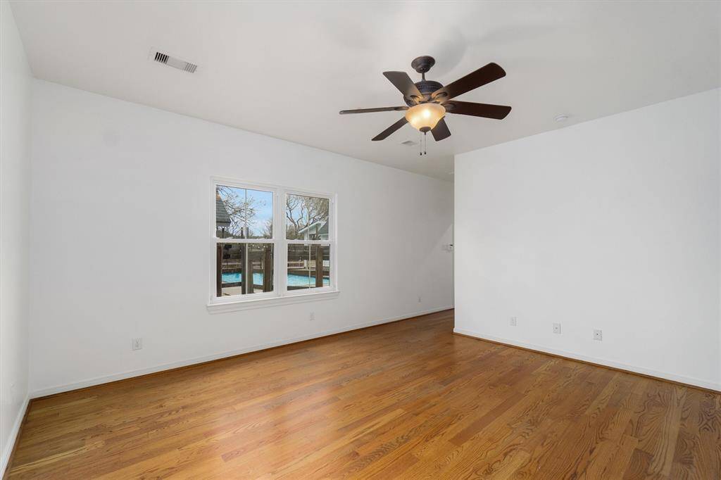 Primary bedroom with window overlooking the pool and the rest of your 3.75 acre property!