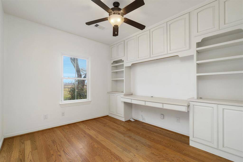 Study on the first floor with built ins, could be used as a fifth bedroom. Window overlooks the front yard.