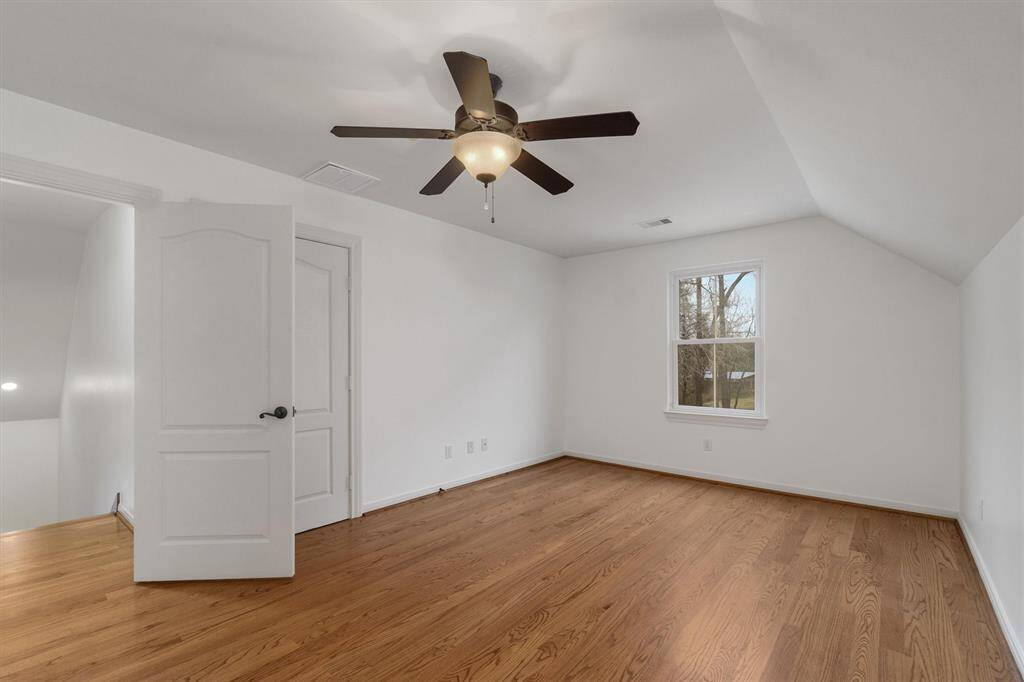 Coming up the stairs, this is the third bedroom on the 2nd floor. Charming dormer windows overlooking the front yard and side yard/driveway.