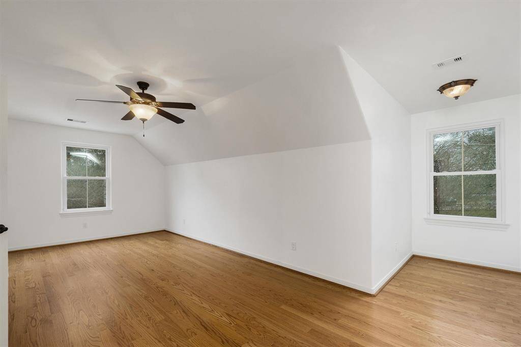 Another view of the third bedroom on the 2nd floor. Charming dormer window overlooking the front yard. Other window overlooks the side yard/driveway.