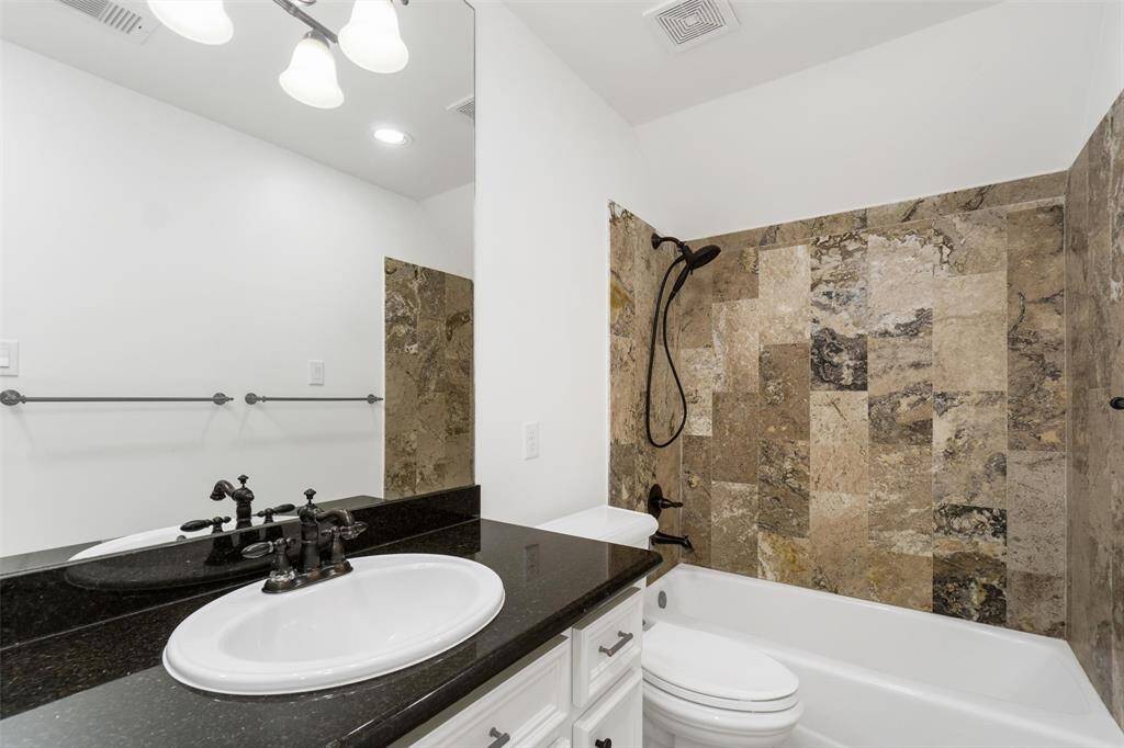 Third full bath upstairs with fully tiled tub/shower combo.