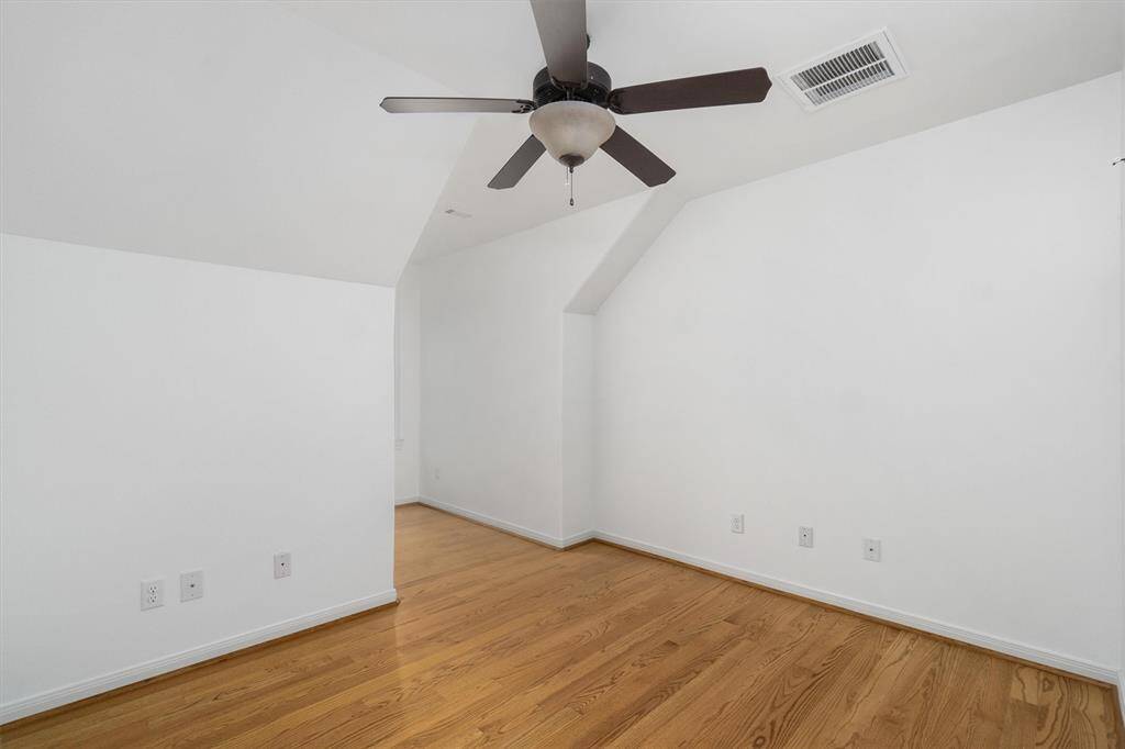 At the end of the hall, 4th bedroom on the second floor. Cute dormer window. Ceiling fan and wood floors. In the hallway, walk out storage.