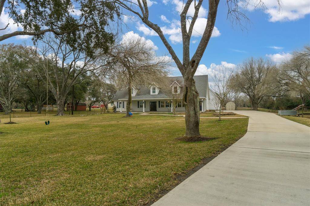 Extended driveway leading to the home.