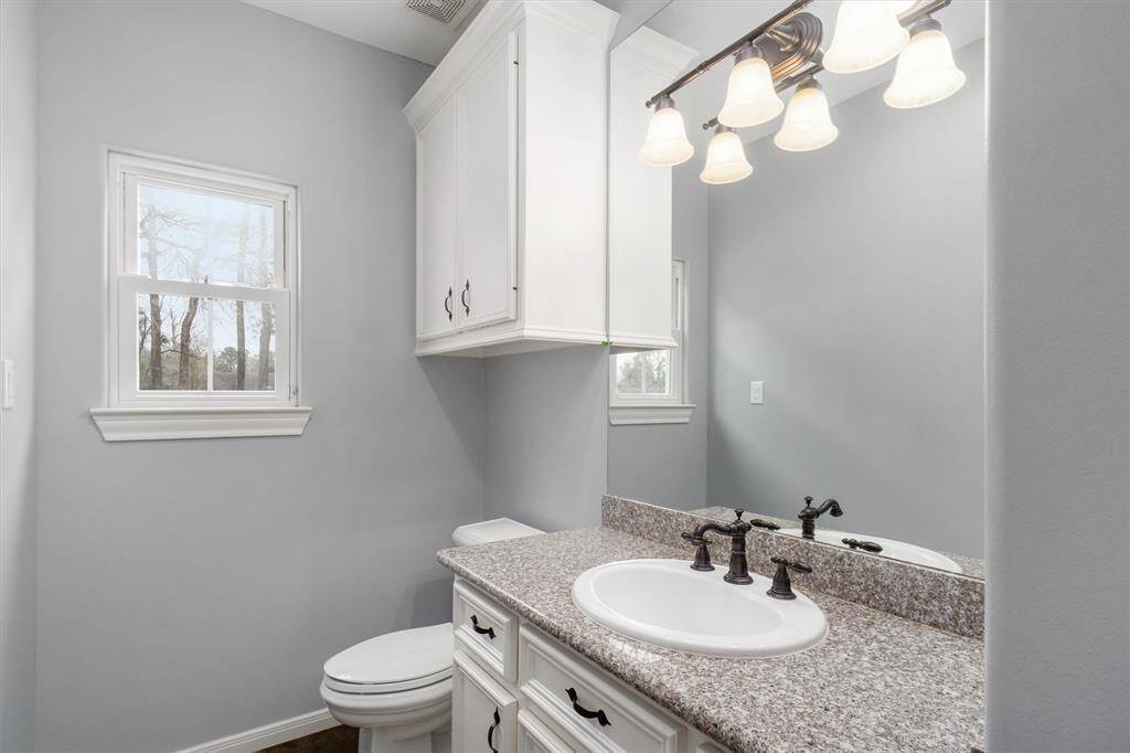 Half bath on the first floor, off the mud room and garage entrance.