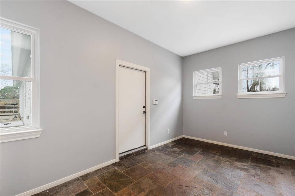 Back enclosed room, storage room or mud room. 3 car garage access.