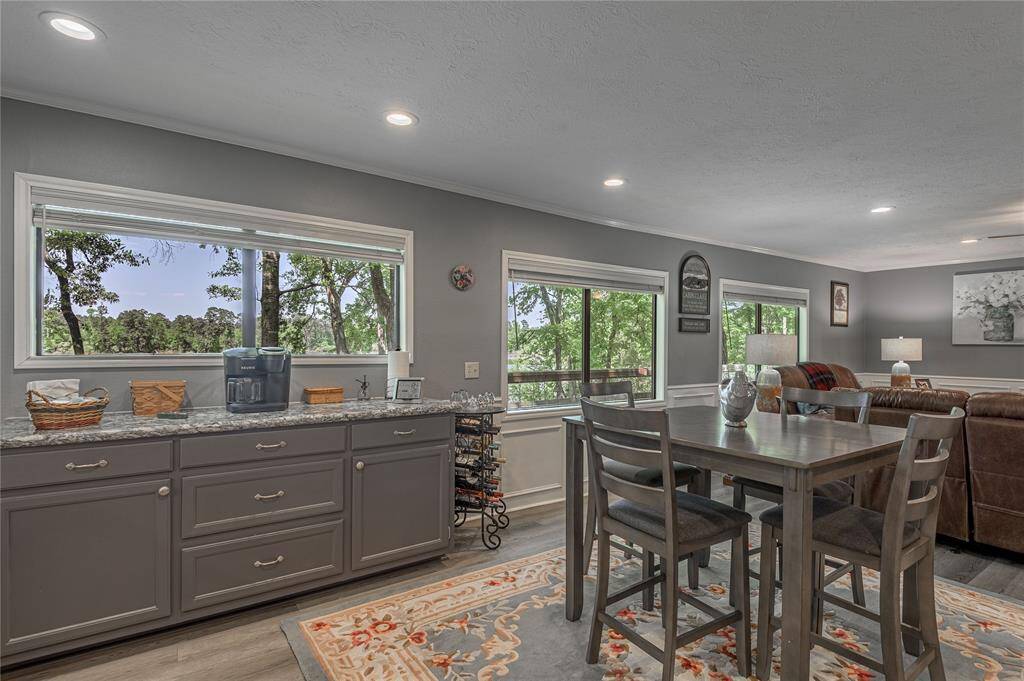 Look at the view you can have with every meal.  Kitchen bar height table and 4 chairs will remain with the home at this price.