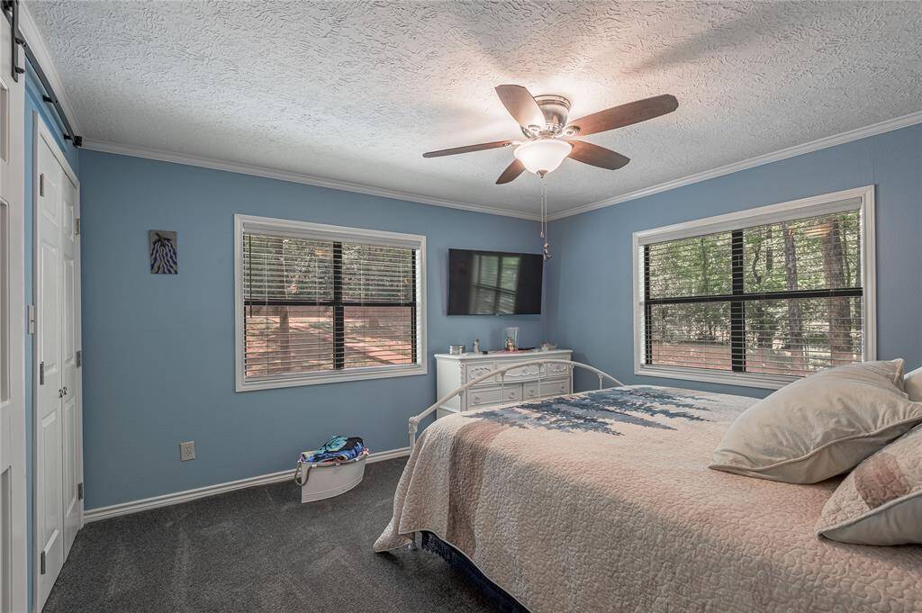 Bed room one has a calm color palette and welcoming decor.