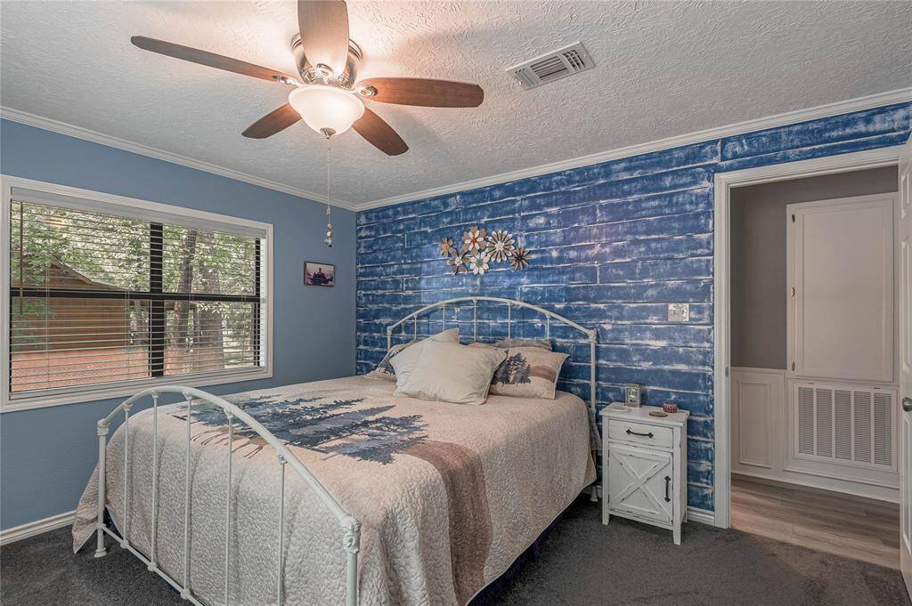 Another view of bed room 1. Look at the accent wall.