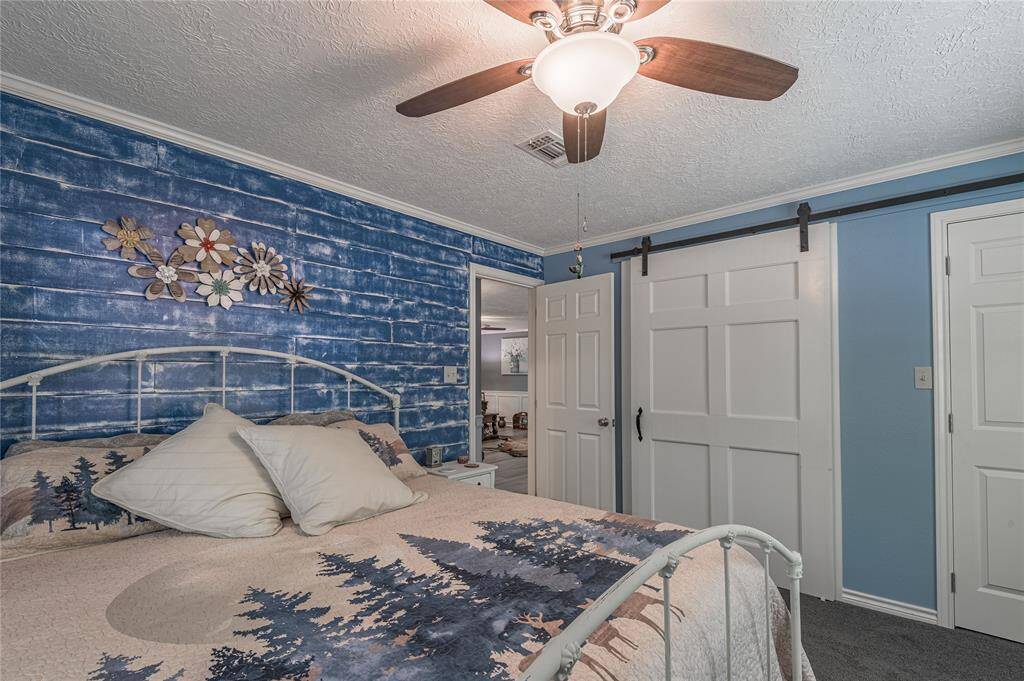 There is ample closet space with a beautiful barn door.