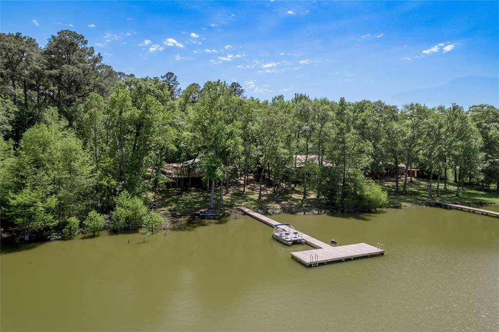 Ariel view of the boat dock/fishing pier. The pontoon boat with trolling motor will stay with the home at list price.