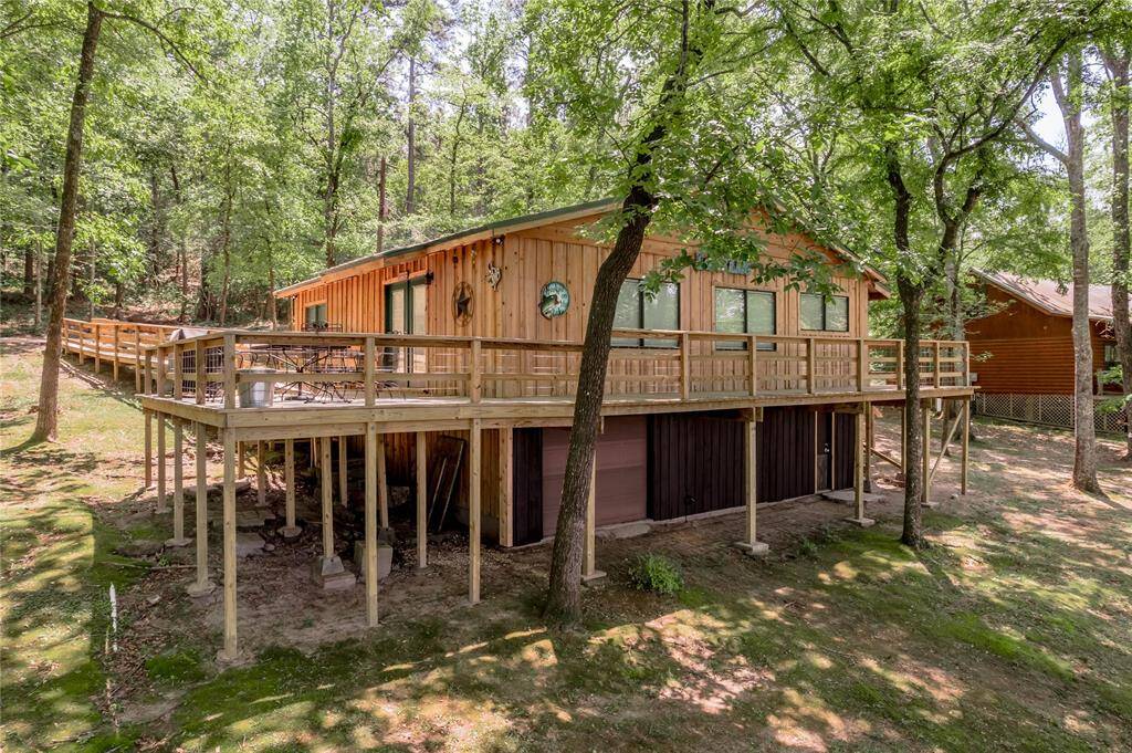 Back view of home and wrap around porch.