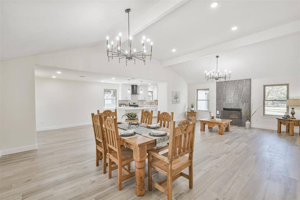 All new wood-look flooring and beautiful light fixtures coupled with the high ceilings give this home a larger than 2,000 sqft feeling.