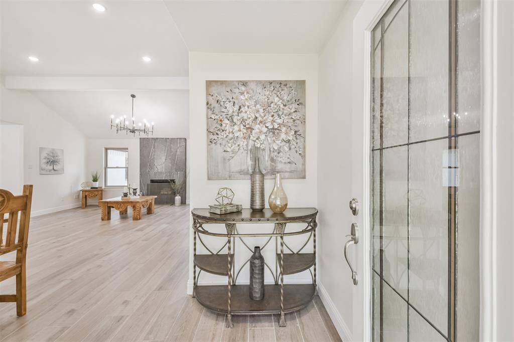 Beautiful beveled glass front door welcomes guests to this gorgeous interior.