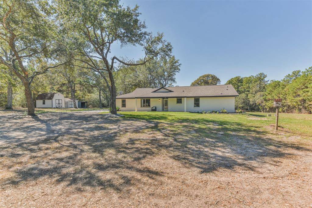 Gated for privacy with lots of lush mature trees, this Texas Ranchette has 3 bedrooms/2bath and a seasonal creek that runs at the back of the property line that draws deer each morning.