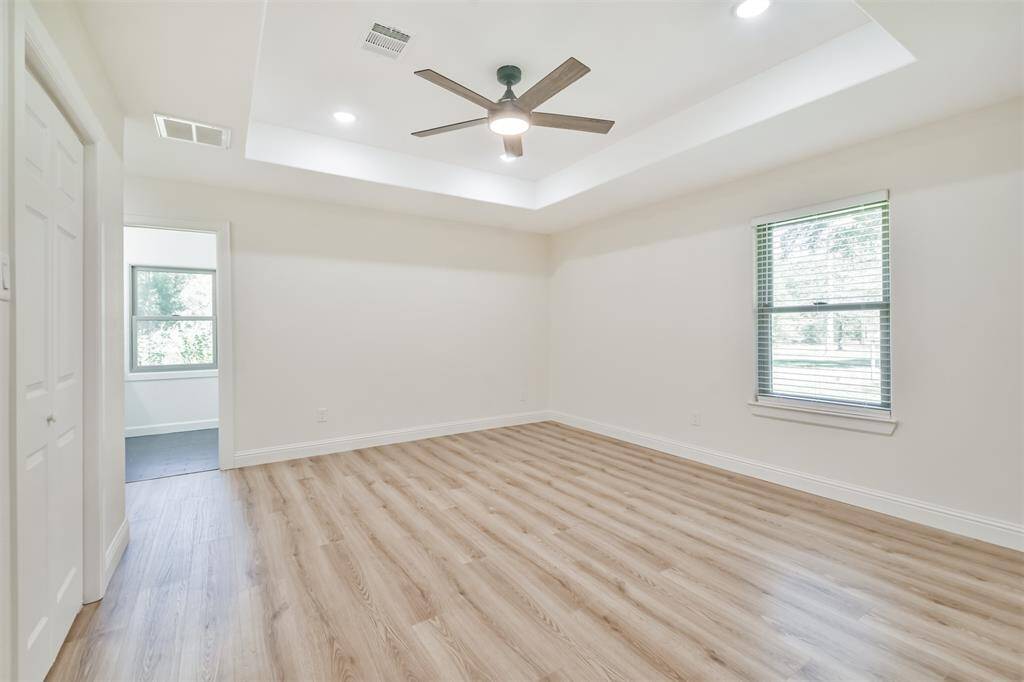 Vaulted ceiling and all LED lighting throughout the home--each room has large windows with views to your lush mature yard.
