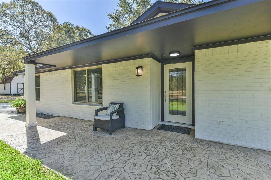 All brick exterior with stamped concrete front entry to the covered porch.