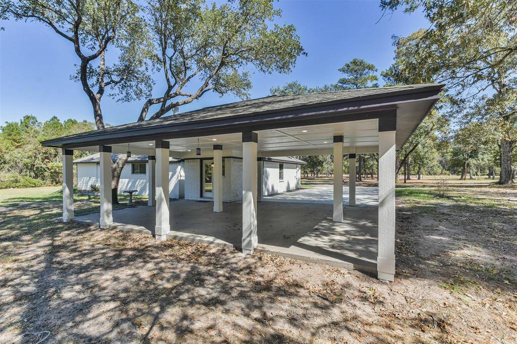 Extended carport and covered patio with plenty of space to entertain.