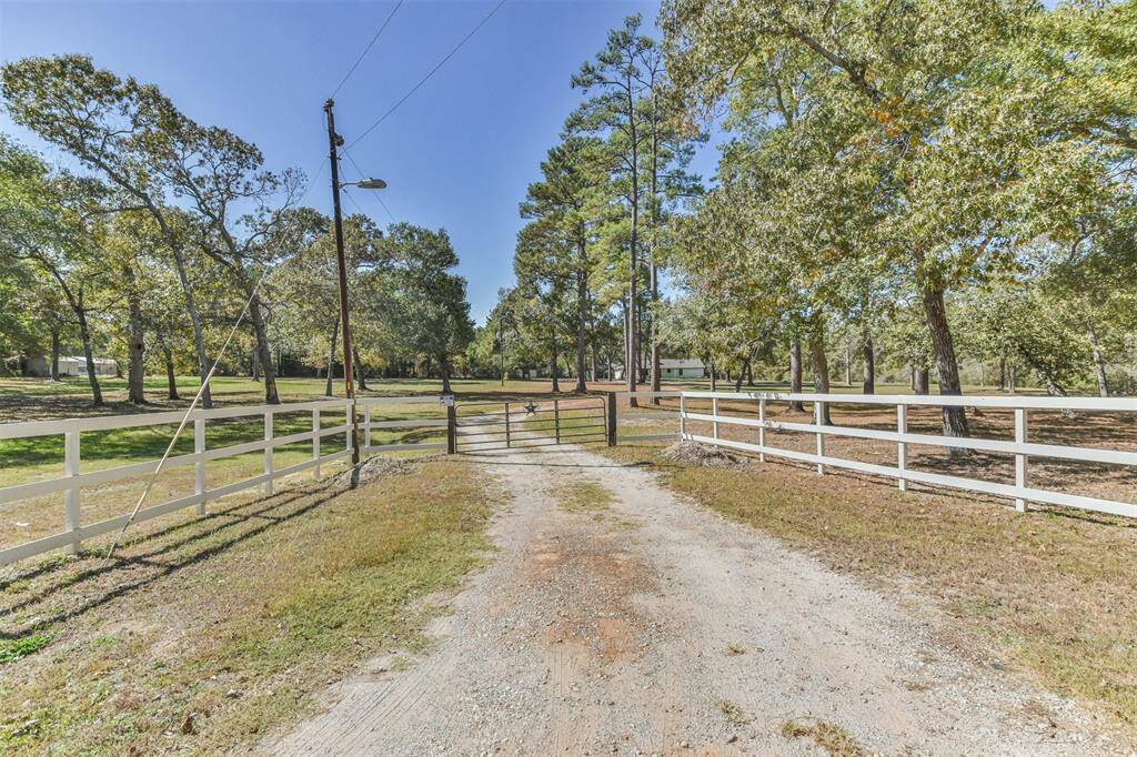 Front metal gate and fencing for privacy.