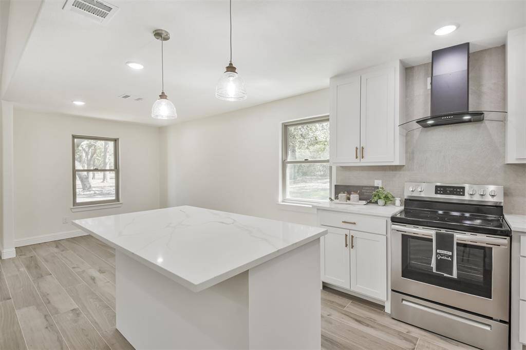 "Model home" kitchen with Quartz counters, stainless appliances and must see backsplash--linen look tile!