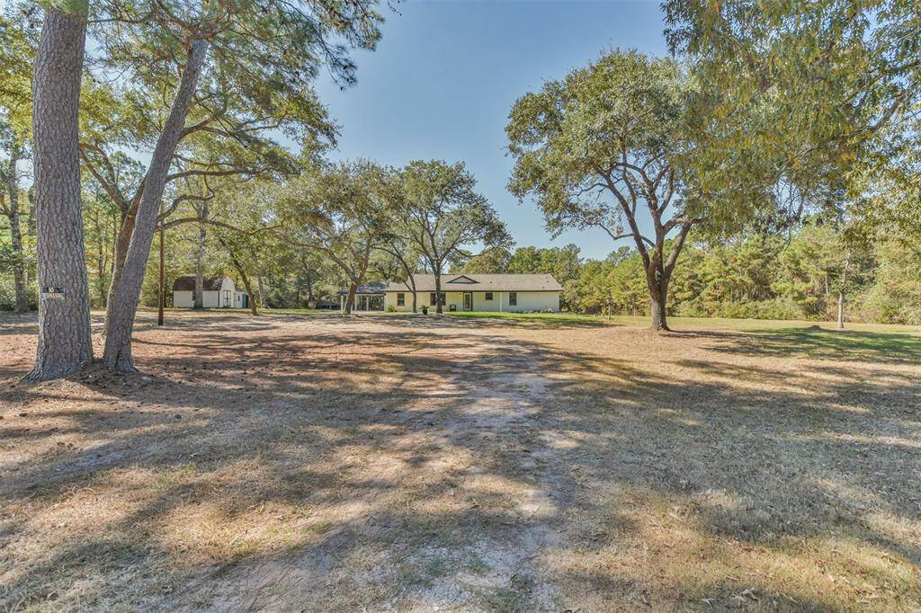 Property is nestled in this 6.5 acre lot full of large trees for privacy and shade--welcome home!
