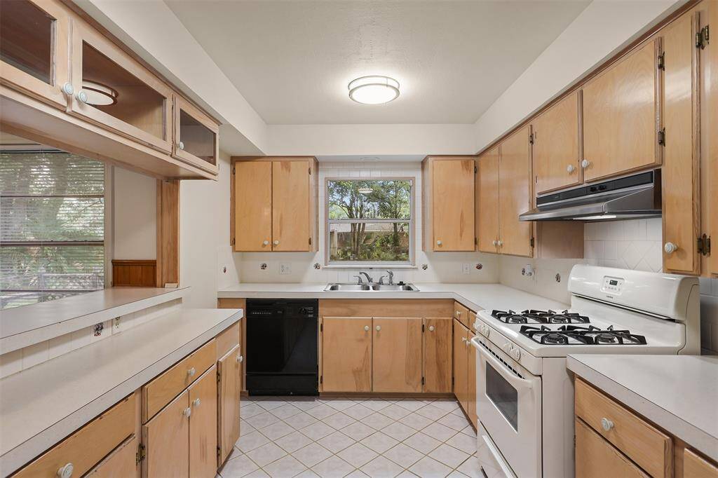 Kitchen with Gas Stove and New Refrigerator.