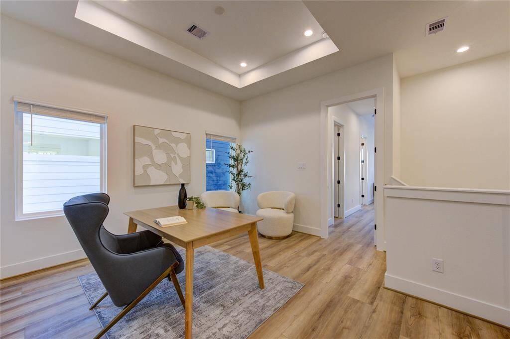 Upstairs flex room staged as an office. Can also be a second living room or even a guest room with a pull-out couch.