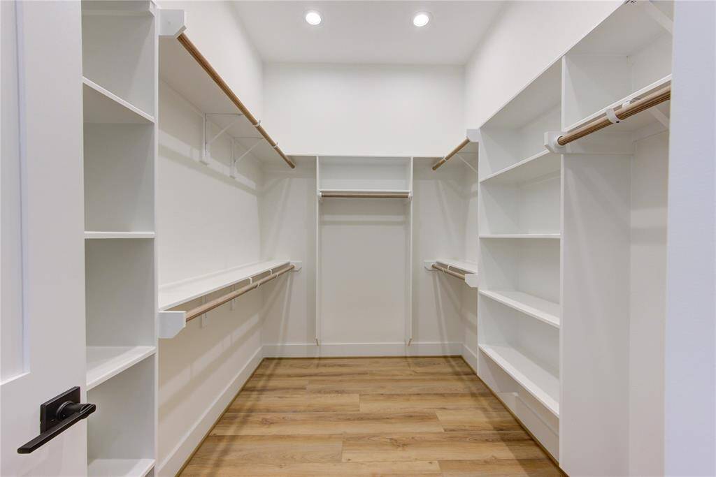 Primary bedroom has two large walk-in closets.