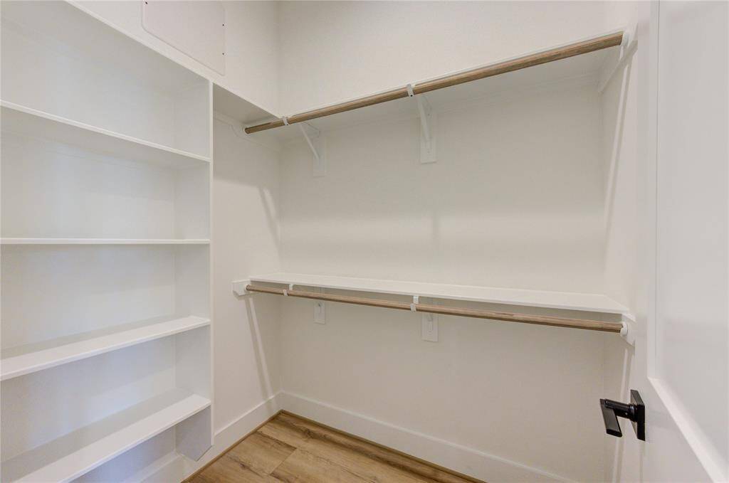 Primary bedroom has two large walk-in closets