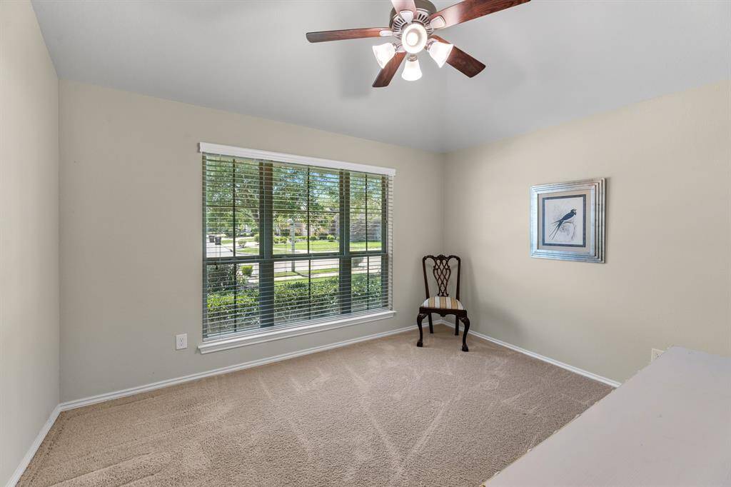 Front bedroom located to the left of the main hallway upon entry.