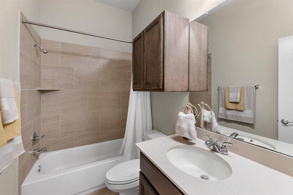 Third full bathroom with shower/tub combo.