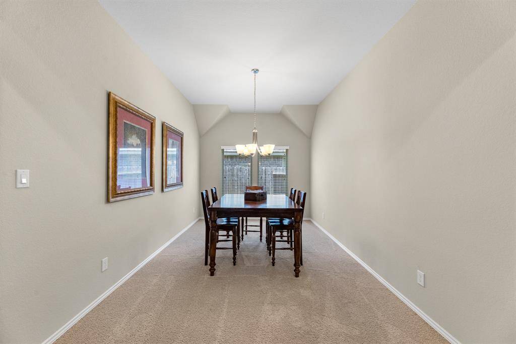 Formal dining room can comfortably fit an extra large dining table and chairs.
