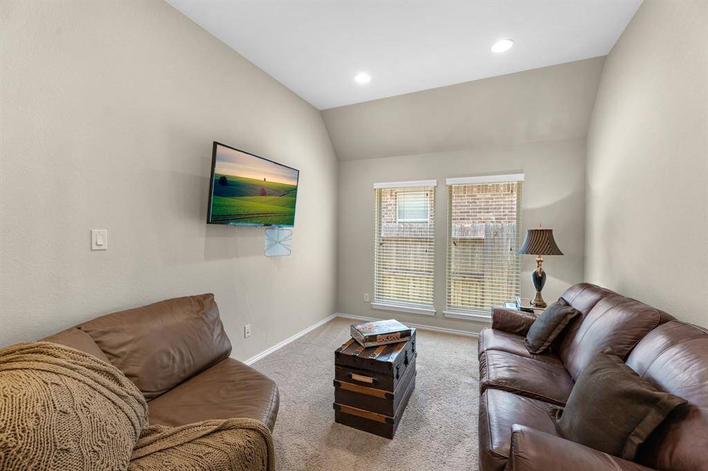 Room off the main hallway across from the formal dining room can be utilized as a home office/study, entertainment or game room.