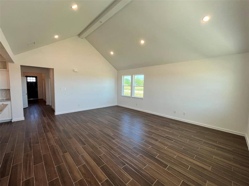 Impressive great room and dining area with vaulted ceilings