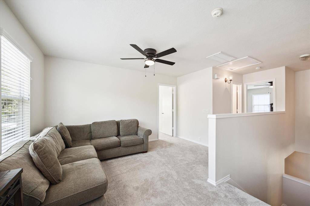 Upstairs gameroom with new carpeting and new ceiling fan. Perfect for relaxing or entertaining.