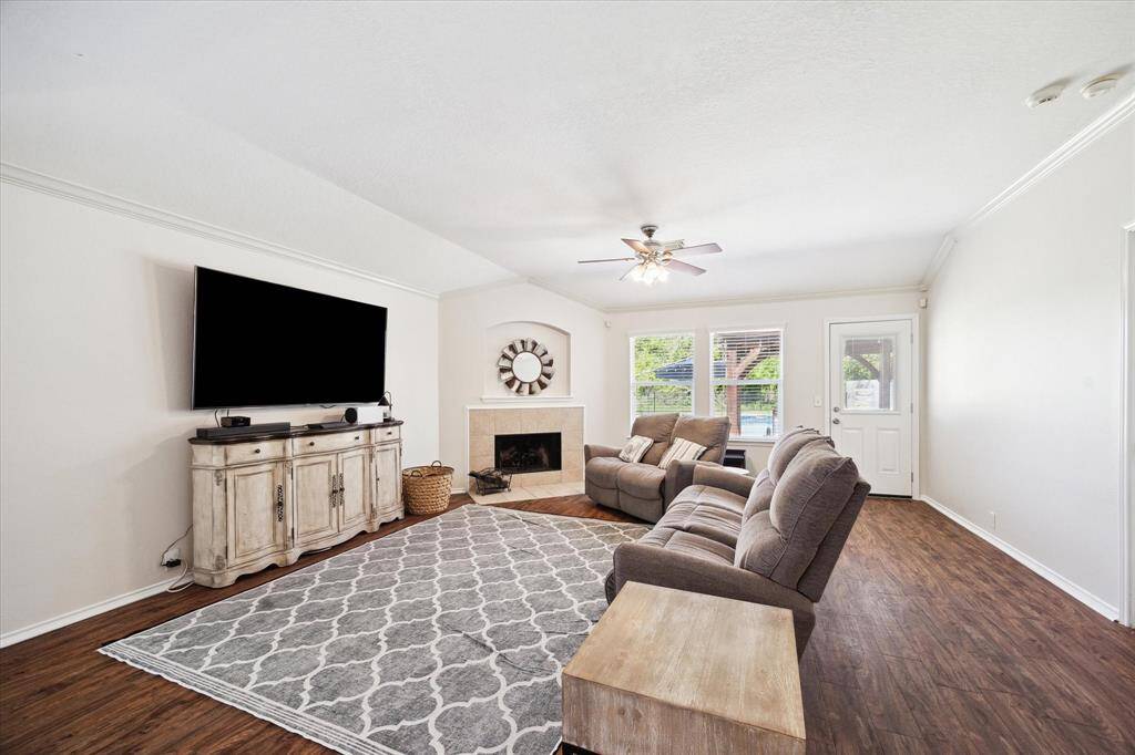 Large family room with wood burning fireplace or gas logs.