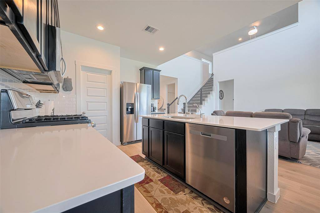 Kitchen with open concept view into Living Room