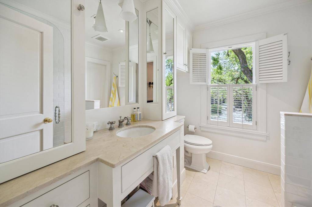 Shared hall bath with tub/shower for the two secondary bedrooms. Great storage.