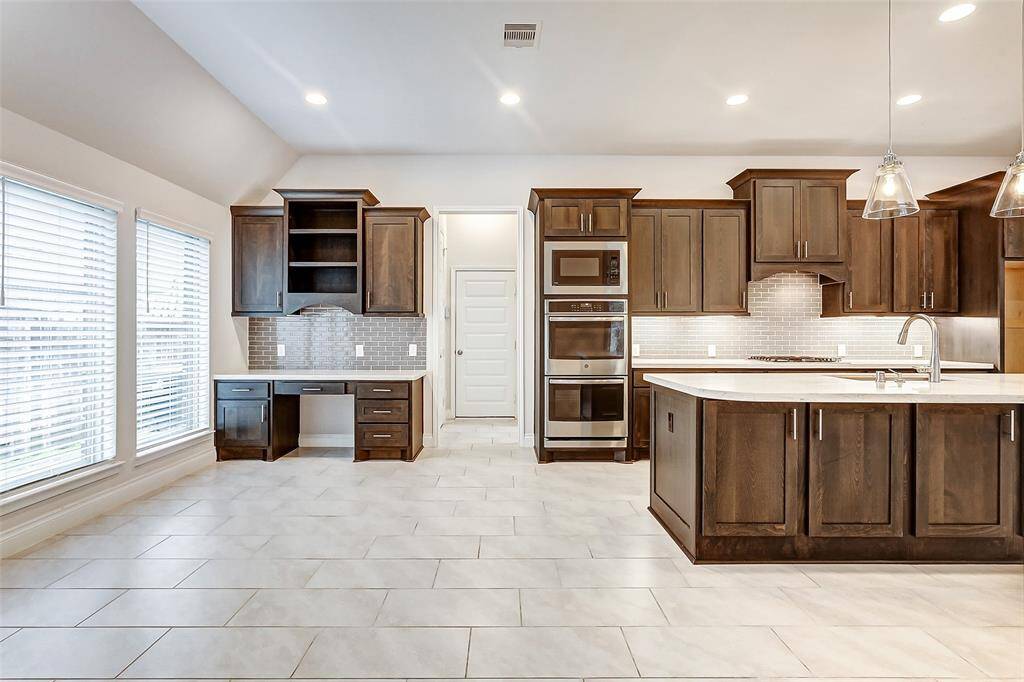 This area offers plenty of room for casual dining, and large windows flood the space with natural light, creating a bright, welcoming atmosphere.
