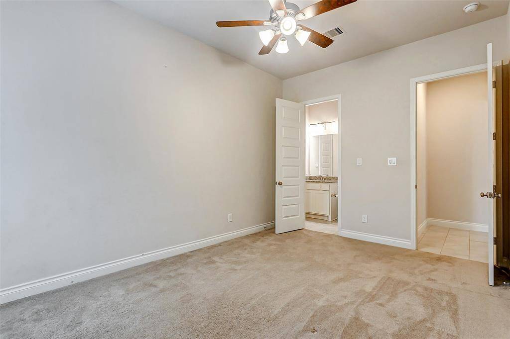 This secondary bedroom is thoughtfully designed with its own private ensuite bathroom, making it an ideal space for a mother-in-law suite, guest bedroom, or any family member seeking their own personal retreat. With its well-appointed features, this bedroom provides a comfortable & welcoming environment.